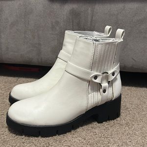 never worn before Lulu’s white boots.